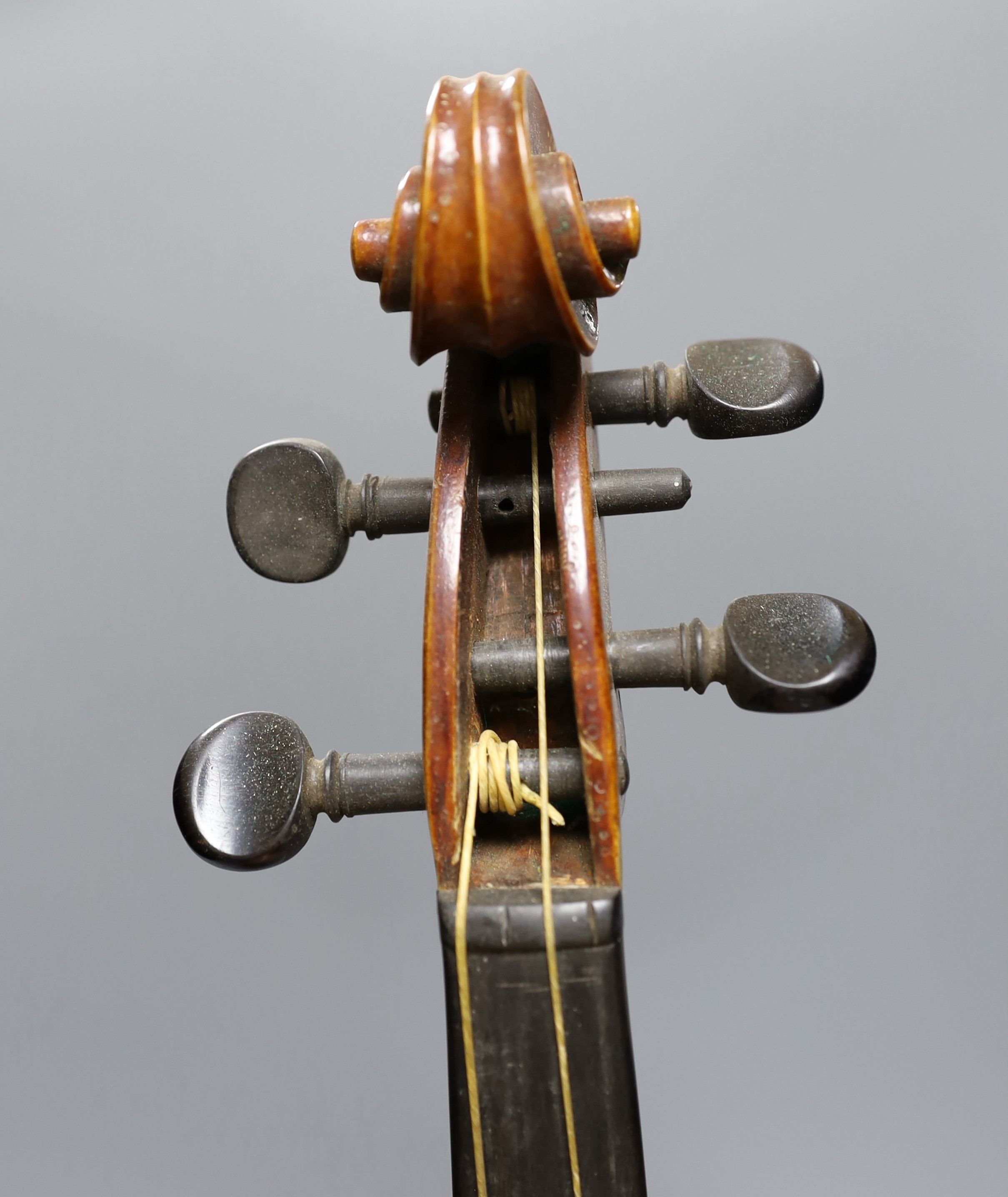 No labe and it is a full sized one.An early 20th century cased violin, length of back 36 cm